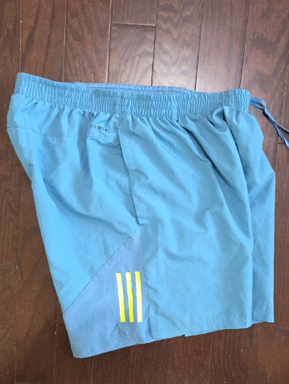 adidas Men's Light Blue Athletic Shorts with Yellow Accent